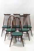 An Ercol darkwood dining table and four stickback kitchen chairs,
