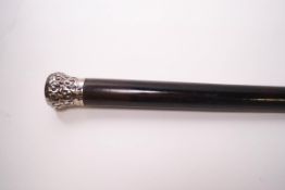 A black evening walking cane with silver tip
