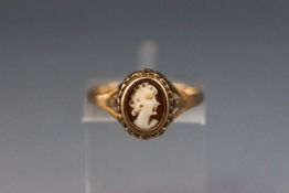 A yellow metal cameo dress ring. hallmarked 9ct gold, london, 1986 Size: K 1.