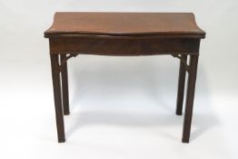 A 19th century mahogany serpentine fronted tea table,