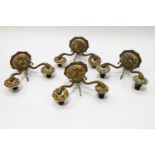 A set of four 20th century two branch wall sconces, the ceramic mounts encrusted with flowers,