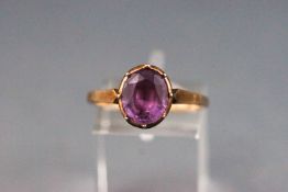 An early 20th century gold and oval amethyst single stone ring, stamped '9ct', size Q 1/2, 2.