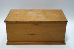 A pine blanket box with side handles,