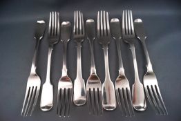 Nine silver fiddle pattern forks, various dates and makers,