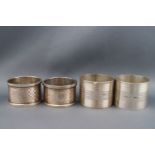 Two pairs of silver engine turned napkin rings, Birmingham 1926,