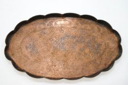 An Arts and Crafts copper tray with central hammered section,