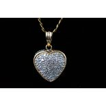 A 9ct gold and diamond heart pendant, 0.5ct I3 clarity and an 18" chain 4.