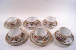 A Dresden porcelain tea service, comprising six cups and saucers and four small plates,
