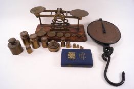 A set of early 20th century Sampson Mordon brass scales and weights, further weights,
