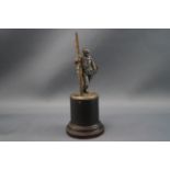 A 1930's WMF silver plated skiing trophy in the form of a gentleman holding his ski,