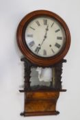 A Victorian walnut drop dial clock with eight day movement and pendulum,