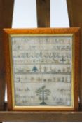 A Victorian alphabet and pictorial sampler by Sarah Denning, 1870, 39cm x 32.