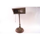 A mid-20th century brass adjustable desk lamp,