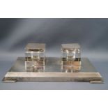 A rectangular silver inkstand, with two square glass inkwells, each with silver mounts,