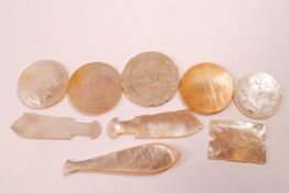 A large collection of mother of pearl gaming counters in the form of fish, round,