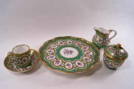 A Sevres cabaret set painted with bouquets and sprays of flowers within oval medallions on an apple