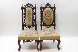 A pair of Victorian mahogany nursing chairs with barley twist supports on cabriole legs and