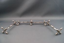 A pair of silver knife rests, London 1876 together with another pair of silver knife rests,