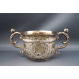 A Victorian silver two handled cup, with "S" shaped handles and half fluted body, 7cm high,