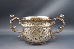 A Victorian silver two handled cup, with "S" shaped handles and half fluted body, 7cm high,