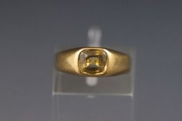 A yellow metal single stone ring set with a greenish yellow chrysoberyl, Size G 4.