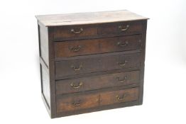 An 18th century oak chest of two short over four long drawers,