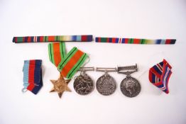 Three WWII medals: Defence, George VI and 1939-45 Star, named to 25324 G H GATEHOUSE,
