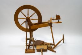 A 20th century spinning wheel and accessories,