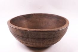 A 19th century treen bowl, 12cm high x 31.