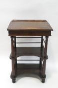 A Victorian rosewood davenport, the rising lid leather with inset writing surface and inlay,