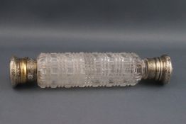 A 19th century facetted cut-glass double-ended scent bottle with foliate engraved parcel gilt
