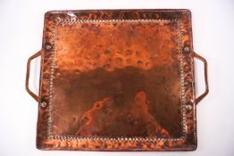 A Newlyn School copper two handled tray by John Pearson, beaded border detail, stamped 'JP',