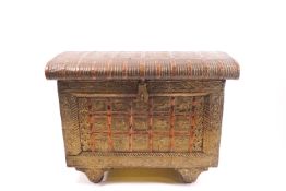An Indian brass and copper casket with hammered animal and pattern decoration,