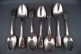 Seven assorted silver fiddle pattern tea spoons, one initialled J M H, various dates and makers,