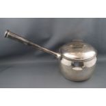 A silver saucepan and cover, with straight tapering handle, 15cm high, London 1908,