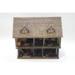 A scratch built dolls house and contents, the house with tile effect roof,
