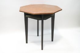 An oak and copper topped occasional table with four undertier shelves,