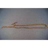 A yellow metal graduated albert chain with Tbar and single swivel clasp. 365mm.
