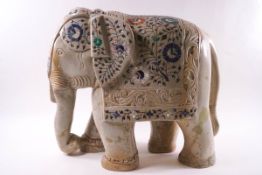 An Indian carved hardstone elephant with inlaid decoration,