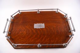 An oak and chrome octagonal two handled tray with gallery,