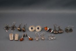A selection of ten pairs of silver earrings consisting of plain and gemset with a variety of drops