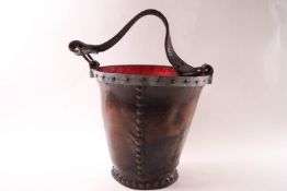 A leather and metal bound fire bucket,