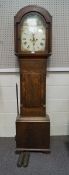 An early 19th century mahogany longcase clock with eight day movement, painted face and arched dial,