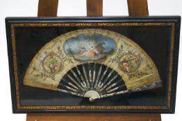 An 18th century French fan, the pierced ivory sticks mounted with white metal decoration,