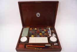 A Reeves & Sons artist's watercolour box in mahogany, 34cm x 25.
