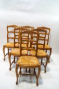 A set of six French ladder back pine chairs,