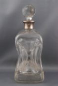 An Asprey silver mounted clear glass 'dimple' decanter and stoppr,