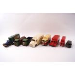 A collection of tin Tri-ang vehicles, comprising of three Minic Transport trucks,