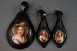 A jet pendant and a pair of earrings depicting a female portrait to each. Gross weight: 26.