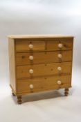 A pine chest of two over three long drawers,